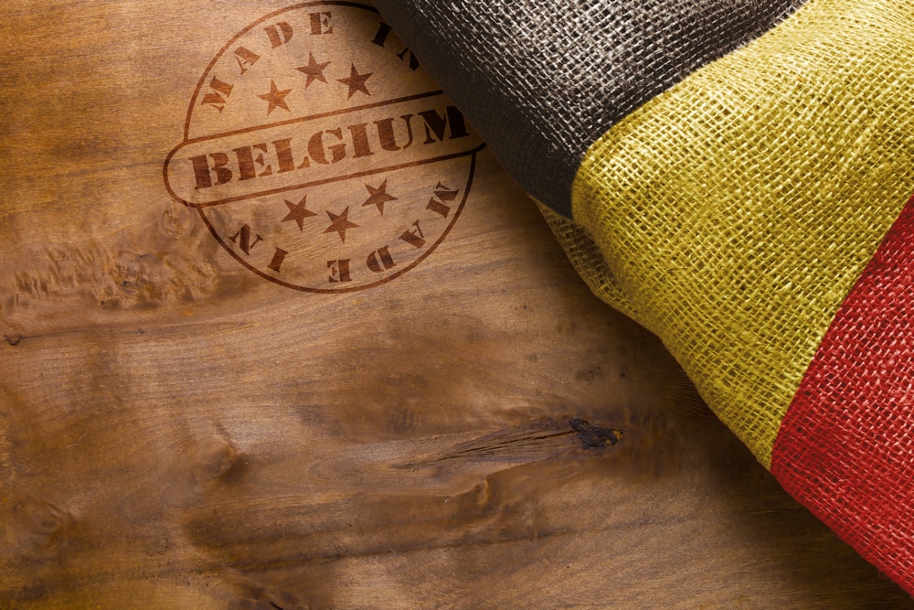 Hot stamp imprint on a wooden surface - Made in Belgium. Belgium flag.