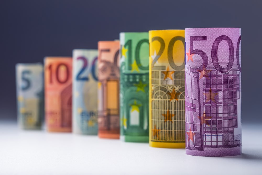 Several hundred euro banknotes stacked by value.Rolls Euro banknotes.Euro currency money.Announced cancellation of five hundred euro banknotes. Banknotes stacked on each other in different positions