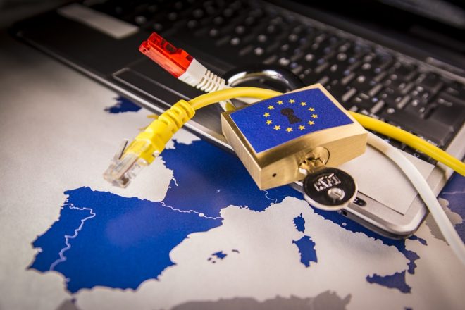 Padlock and net cable over a laptop and a EU map, symbolizing the EU General Data Protection Regulation