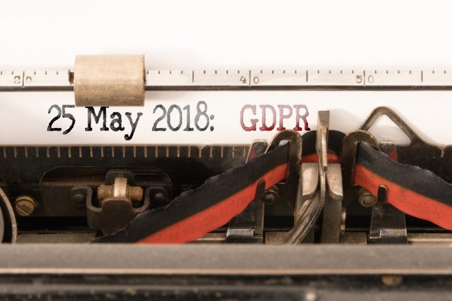 GDPR EU General Data Protection Regulation and commencement date written on vintage manual typewriter