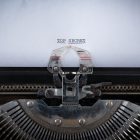 Increasing Transparency The phrase Top Secret typed on an old Typewriter