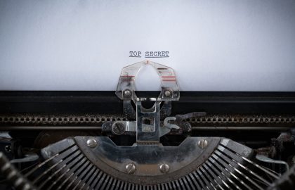 Increasing Transparency The phrase Top Secret typed on an old Typewriter