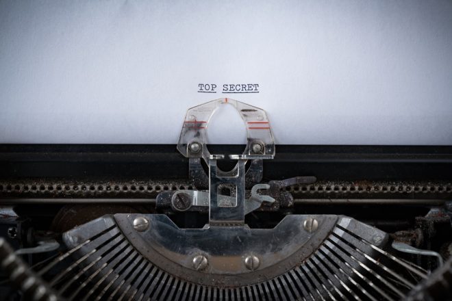 The phrase Top Secret typed on an old Typewriter