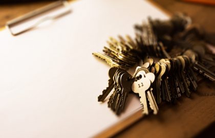 Keeping More Data in the European Union Many brass and chrome old keys on a clipboard with blank white paper. Security and encryption, concept image.