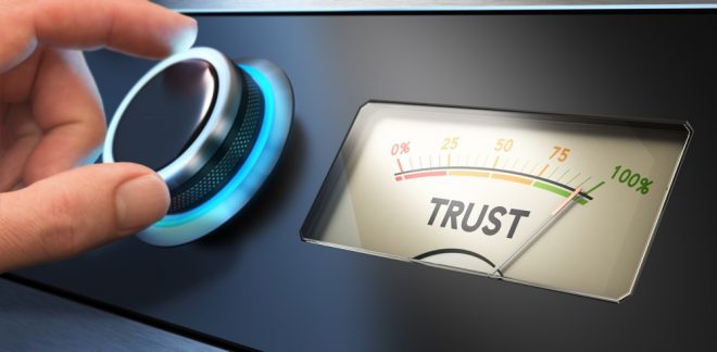Hand turning a knob up to the maximum Concept image for illustration of trust in business.
