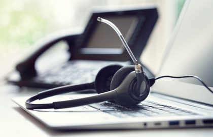 Getting Started With Hosting, Email, FTP and More VOIP headset headphones telephone and laptop concept for communication, it support, call center and customer service help desk