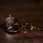 Final Call on IOL Email Vintage pocket watch and hour glass or sand timer, symbols of time with copy space