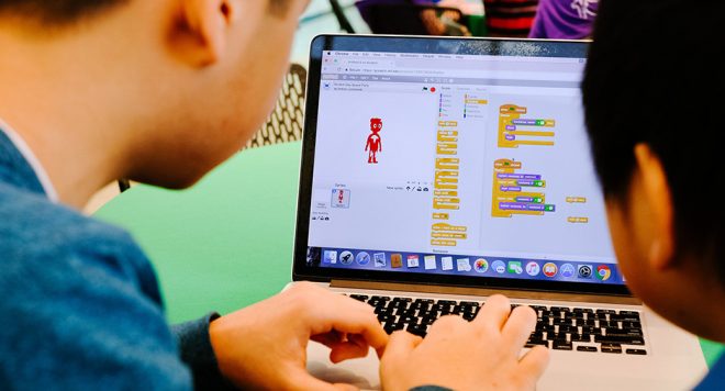 Kids coding using Scratch. Image courtesy of the Scratch Foundation