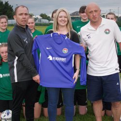 Blacknight Backs Carlow Girls for Gaynor Cup Leona Glover of Blacknight presents the new team jerseys to the Carlow U-15 Girls' Gaynor Cup Team