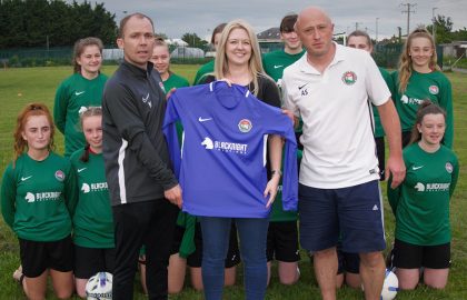 Blacknight Backs Carlow Girls for Gaynor Cup Leona Glover of Blacknight presents the new team jerseys to the Carlow U-15 Girls' Gaynor Cup Team